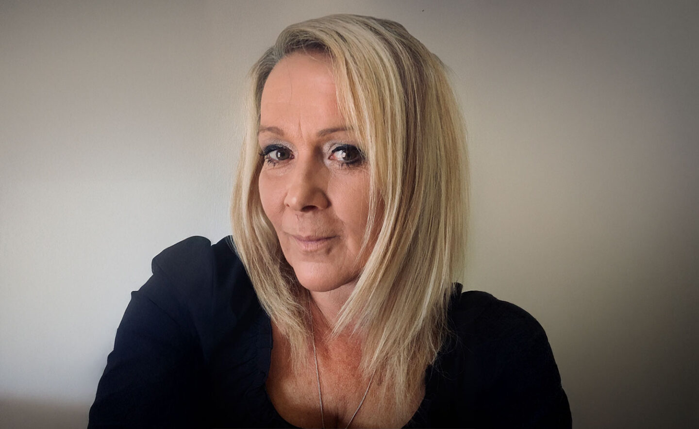 Headshot of Sophie Hall - a white woman with long blonde hair.